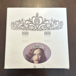 Beautiful metal tiara with hair combs on both sides. Sparkling rhinestones.